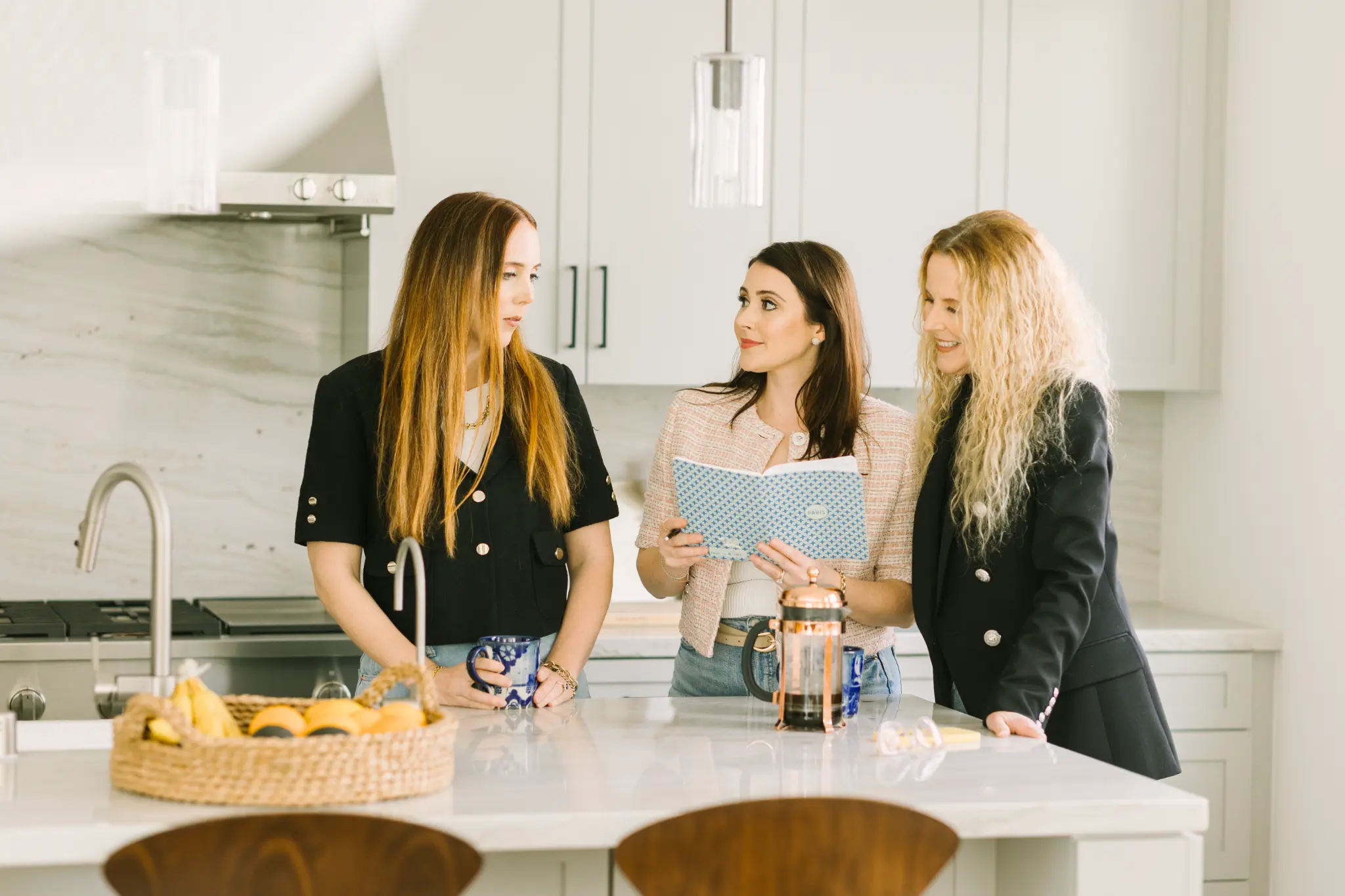 Three women entrepreneurs in modern kitchen