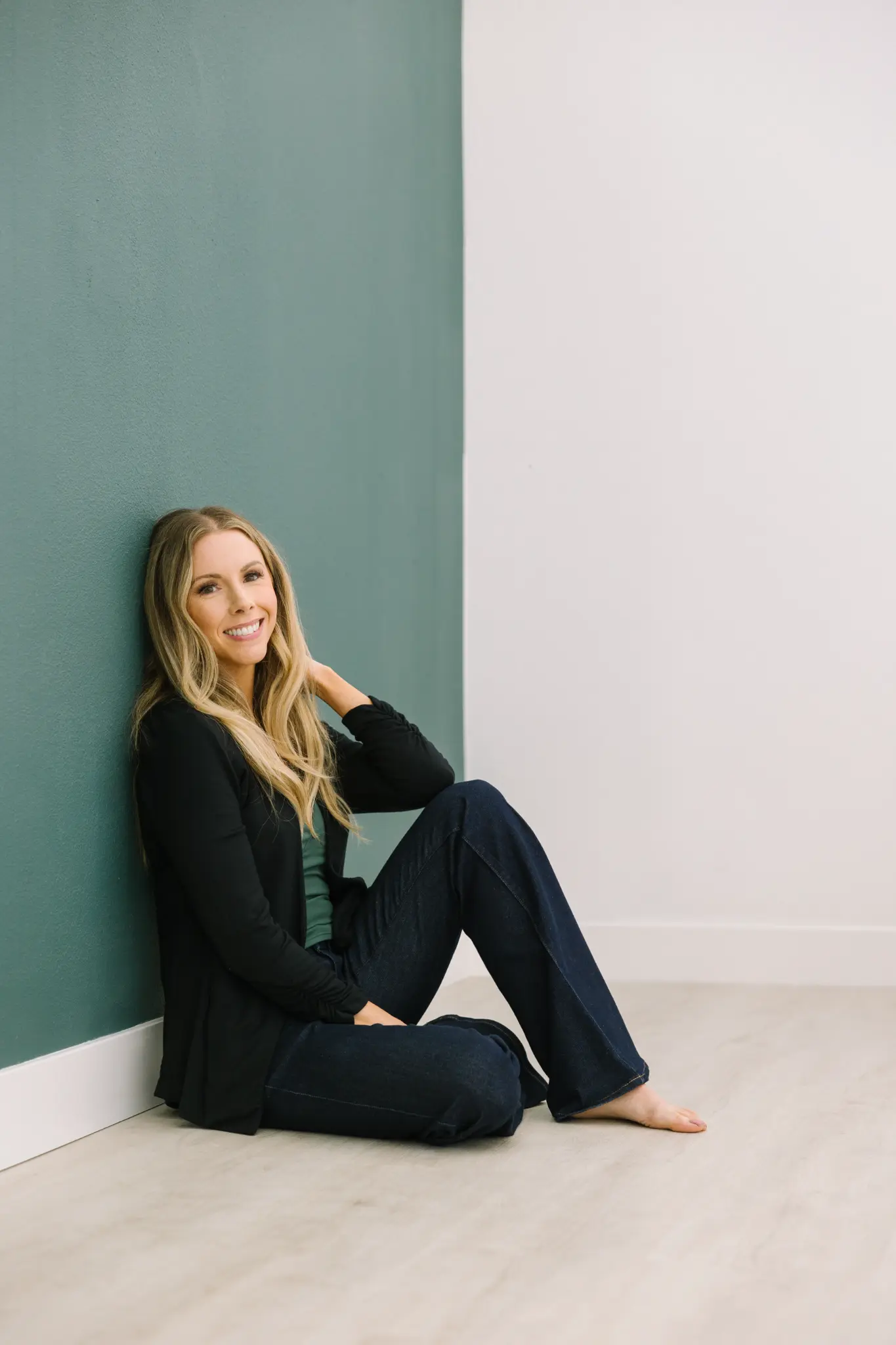 Meghan against teal wall